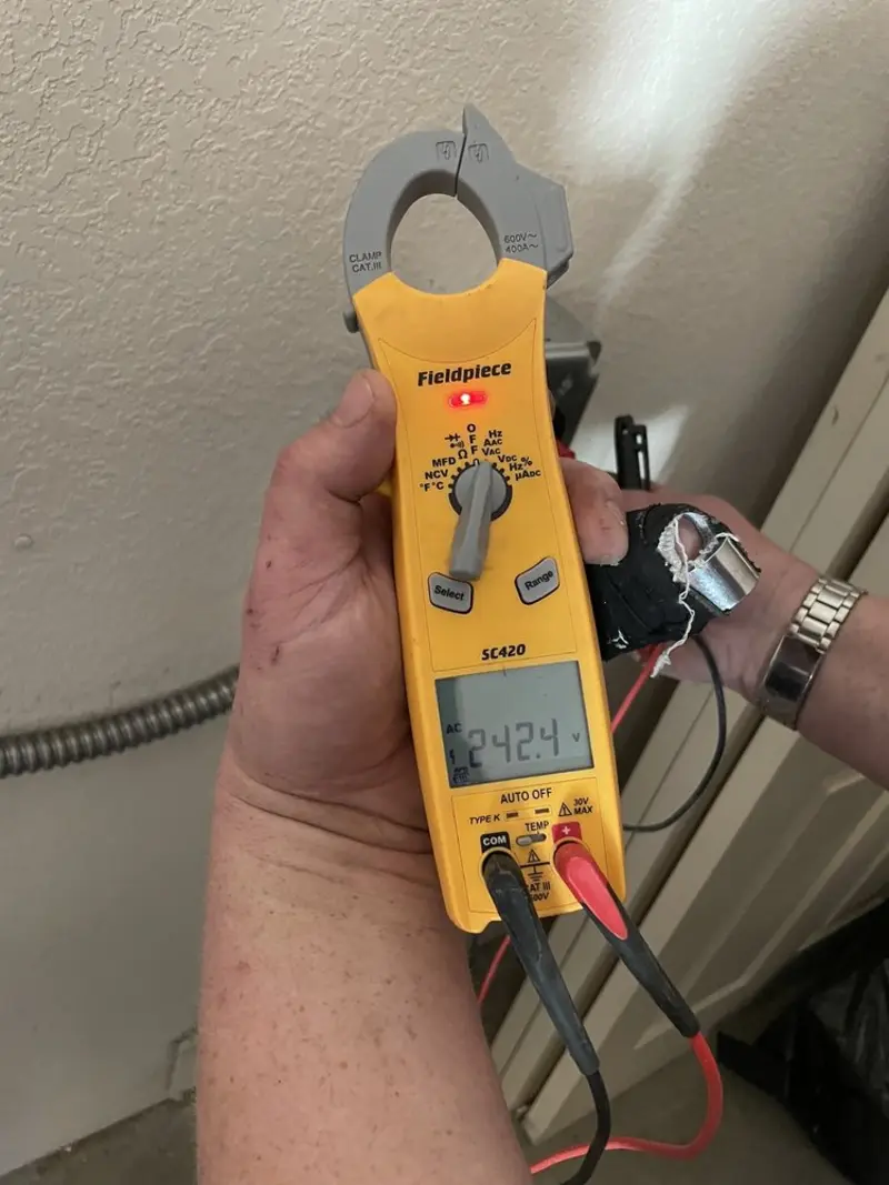 Voltage testing with clamp meter during Hot Tub / Pool Electrical Wiring in Moody